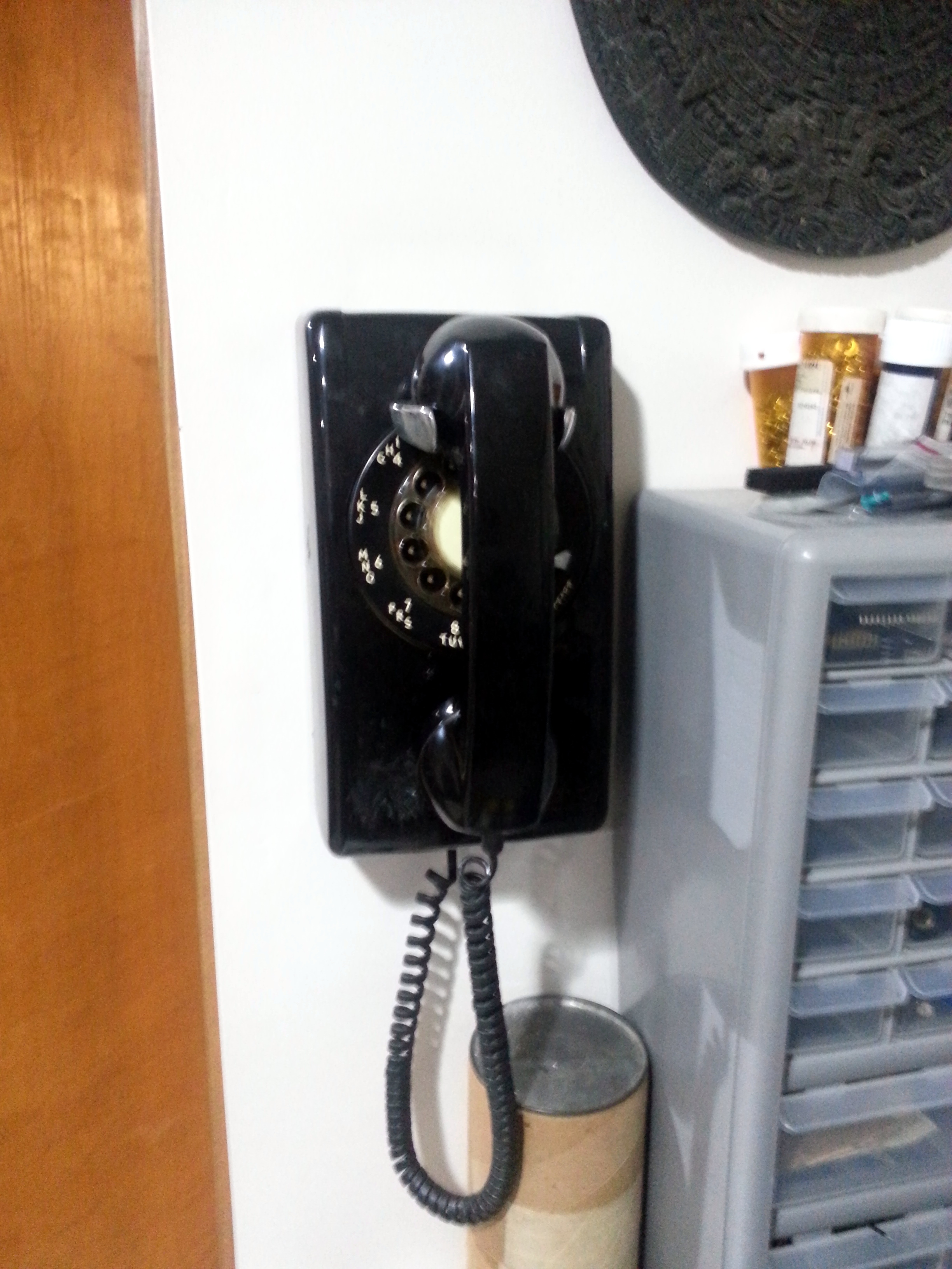 Pic of rotary phone hanging on the wall