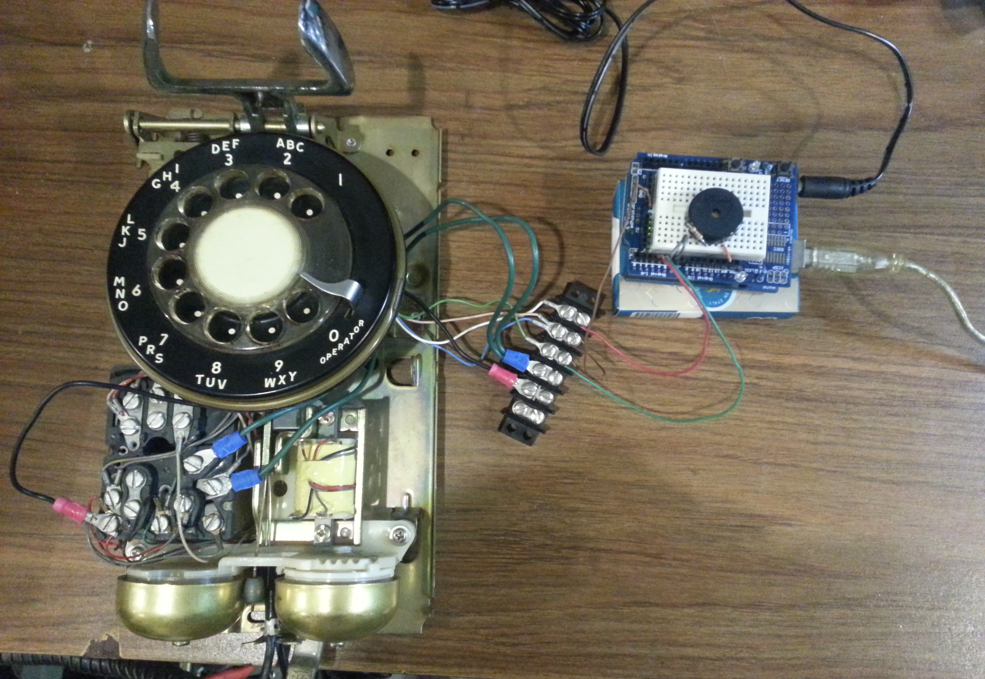 Pic of opened rotary phone with experiment Arduino attached
